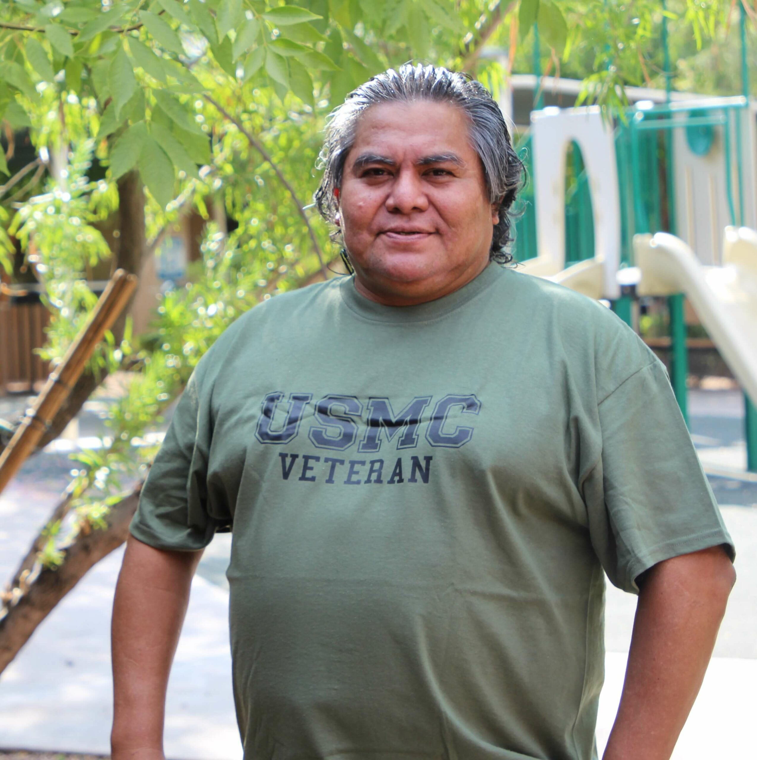 Dave Veteran Dave stands proudly at his Desert Leaf apartment in his USMC Veteran shirt
