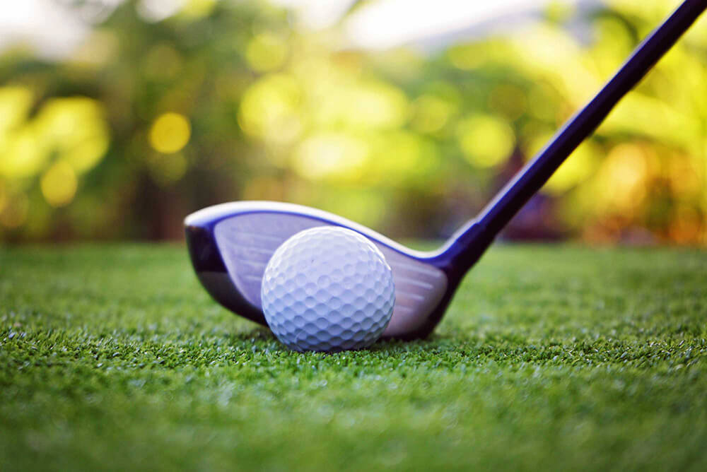 bigstock Golf Ball And Golf Club In Bea 376976275 edit