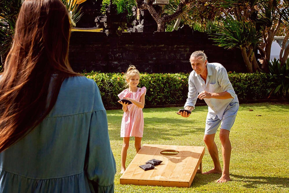 bigstock Happy Family Playing Cornhole 385878094 edit